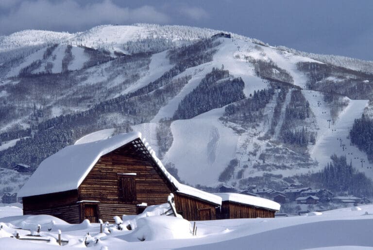 An historic cabin blanketed in snow near steamboat resort