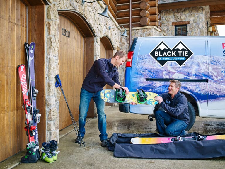 black tie ski rental technicians delivering rental equipment to the mountain