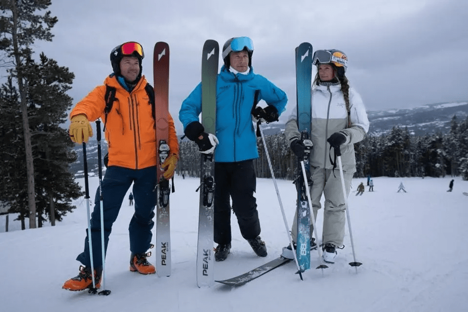 Bode Miller with Chris Davenport holding Peak Skis