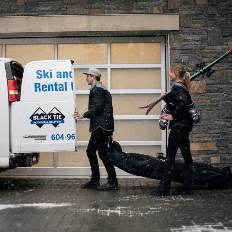 black tie ski staff performing a simple ski rental delivery