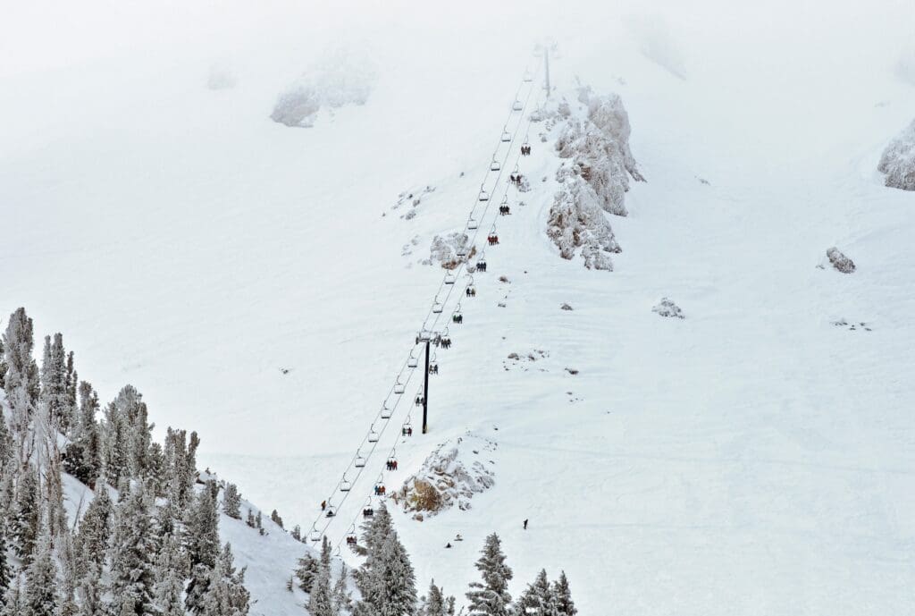 Ski lift chair ascending the mountainside at mammoth